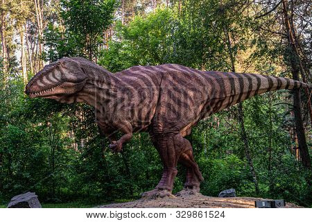 Belgorod, Russia - May 31, 2019: Full-size Gigantosaurus Statue In The Forest Of Belgorod Dinopark. 
