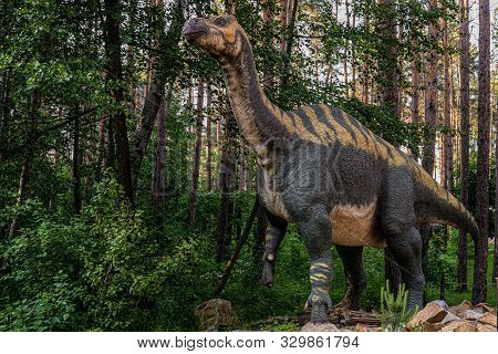 Belgorod, Russia - May 31, 2019: Full-size Iguanodon Statue In The Forest Of Belgorod Dinopark.
