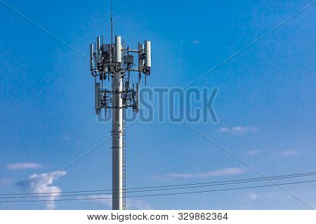 A Low Angle View Of A Cell Site Tower For Broadcasting Mobile Data And Communication Signals, Common