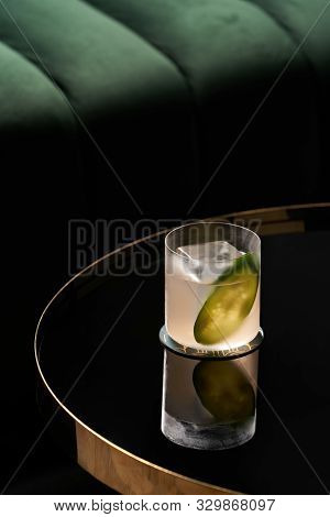 Fresh Cocktail Glass On Glass Table In Night Club Restaurant