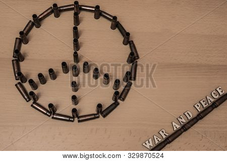 Symbol Of Peace Made From The Shells Of Military Rifle With The Inscription War And Peace In The Cor