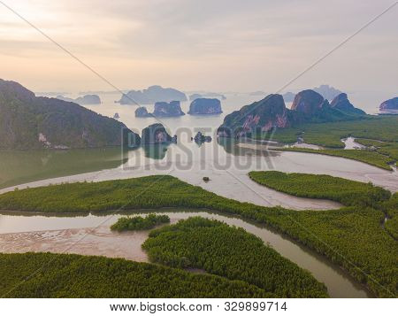 Aerial Top View Of Samet Nangshe, Mountain Valley Hills, And Tropical Green Forest Trees At Sunset W