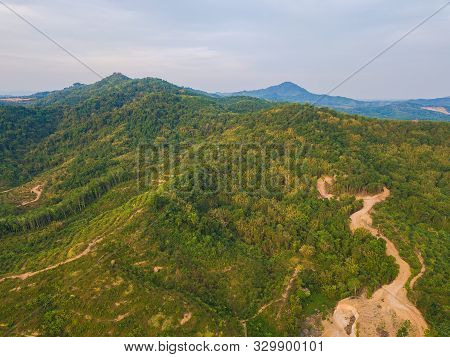 Aerial Top View Of Samet Nangshe, Mountain Valley Hills, And Tropical Green Forest Trees At Sunset W