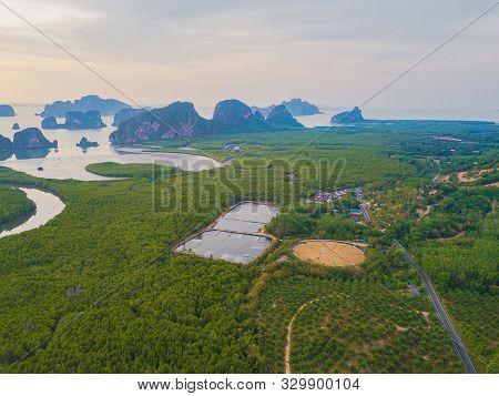 Aerial Top View Of Samet Nangshe, Mountain Valley Hills, And Tropical Green Forest Trees At Sunset W