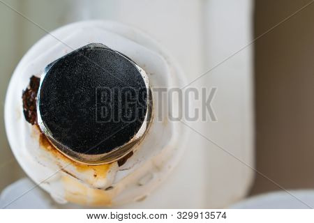 Rusty Plug Of A Central Heating Radiator.  Point Of Leakage.