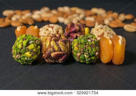 Middle East Pistachio And Peanut Snack. Healthy No Sugar Food. Pistachio And Almond Nuts On The Back