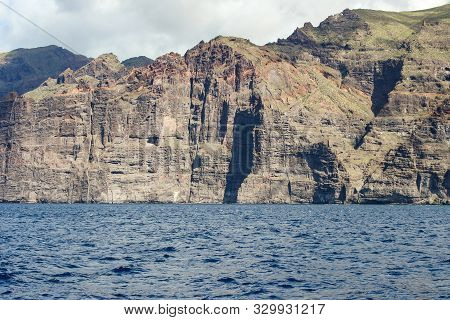 View On The Steep Coast Of Los Gigantes On Canary Island Tenerife With Rocks In Different Colors