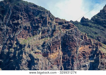 View on the steep coast of Los Gigantes on canary island tenerife with rocks in different colors