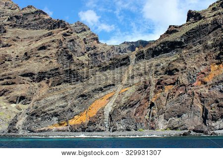 View On The Steep Coast Of Los Gigantes On Canary Island Tenerife With Rocks In Different Colors