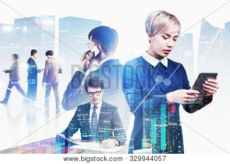 Team Of Successful Young Business People Working With Gadgets And Documents In Modern City With Doub