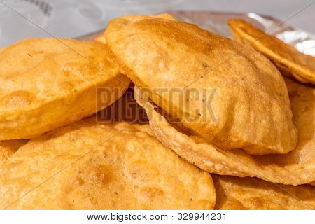 Indian Cuisine Puri Close Up, Delicious Deep Fried Poori (puri) Served.