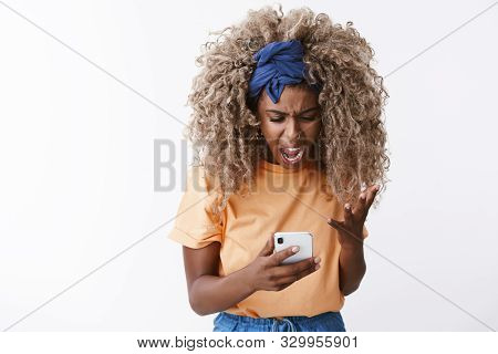 Outraged And Pissed African-american Blond Female Blogger, Afro Hair, Stylish Blue Headband, Yelling