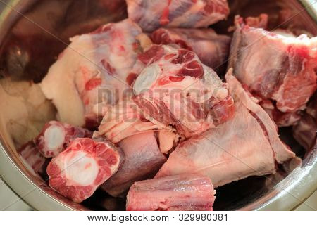 Cutted Oxtail In A Bowl. Raw Meat