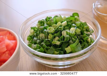 Minced Green Onion In A Glass Bowl