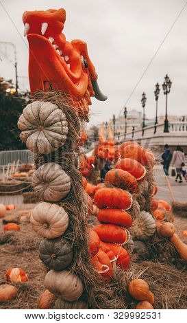 Hand-made Decor With Pumpkins Figures Of Animals. Pumpkin Dragon On Halloween With Nobody