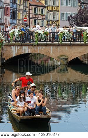 Colmar, France, June 27, 2021 : Cruise On The Lauch River. Petite Venise Is A Picturesque Tourist Ar