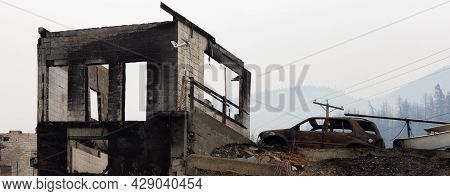 Fire Debris Of Houses In A Small Town With Smoke In Sky. Caused By Forest Wildfires In Lytton, Briti