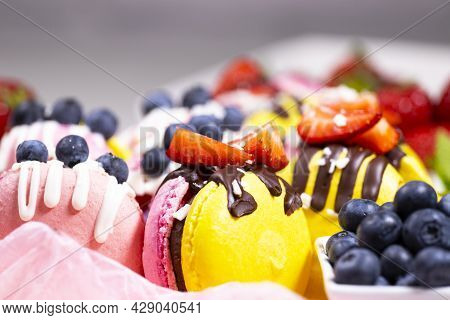 Macaroon, Handmade Beautiful Sweet Food, Dessert With Fresh Strawberries And Blueberries Decorated W