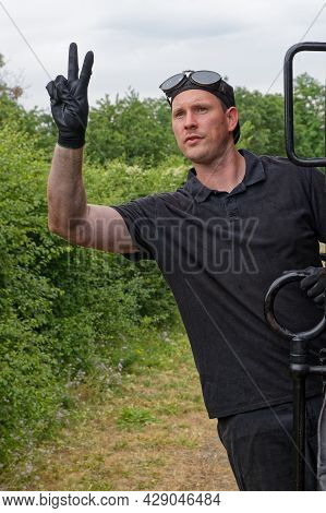 Neuf-brisach, France, June 27, 2021 : Portrait Of A Conductor In Action. A Group Of Volunteers Regul