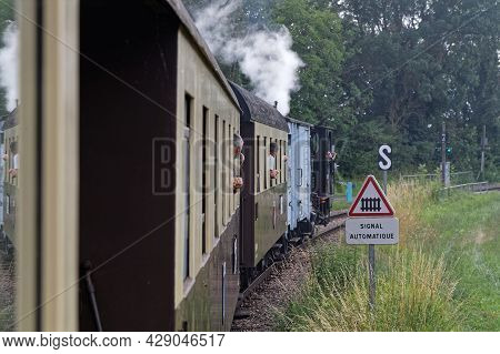 Neuf-brisach, France, June 27, 2021 : Steam Train At The Crossing. A Group Of Volunteers Regularly O