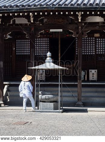 Saijo, Ehime Prefecture, Japan - April 12, 2018: O-henro Buddhist Pilgrim In White Robes At Kichijoj