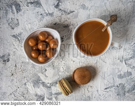 Coffee With Cream And Sweets, Caramel And Macarons Top View