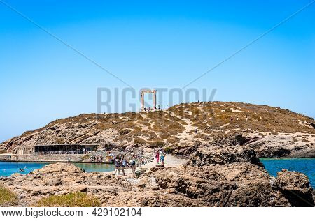 Naxos, Greece - July 23 2016: View Of Palatia Hill With The Portara Doorway On Top. Portara Is The R