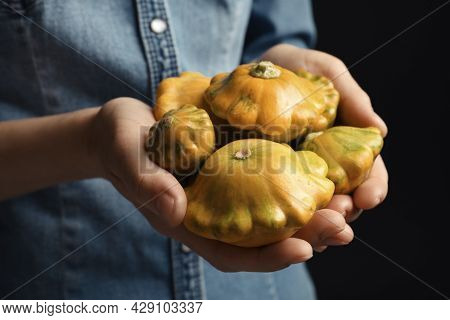 Woman With Fresh Ripe Pattypan Squashes On Black Background, Closeup