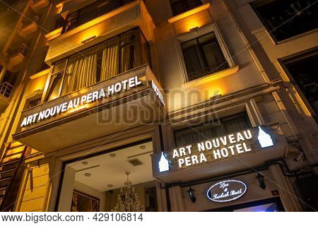 Beyoglu, Istanbul, Turkey - 07.07.2021: Exterior Of Art Nouveau Pera Hotel With Yellow Night Lights 