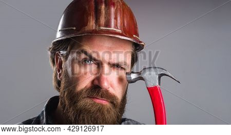 Carpenter With Hammer In Hand. Carpentry, Renovation, Building And Construction. Home Improvement Bu