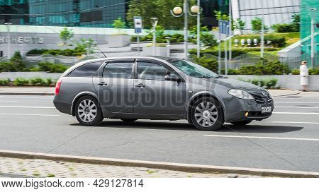 Nissan Primera P12 Wagon In Gray Color On The Street In Motion. Moscow, Russia - July 2021