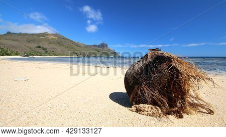 A Rocky Beach Next To A Body Of Water