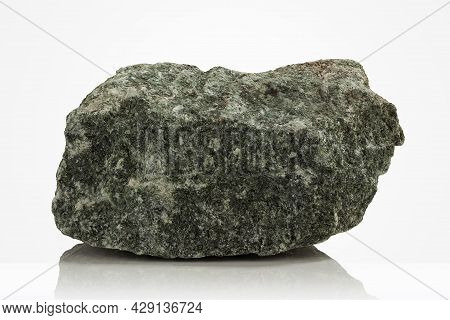 Rough, Untreated Piece Of Jadeite On A Light Background