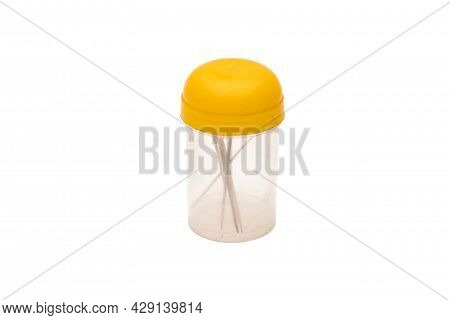 Small Old Container Or Bottle With A Few Toothpicks On An Isolated White Background