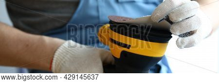 Master Holds Sander In His Hands And Changes Disc