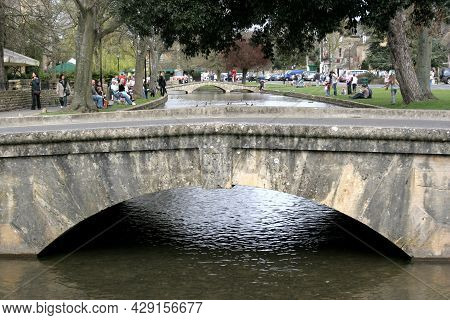 A Foot Bridge Over The River Windrush At Bourton On The Water In Gloucestershire In The Uk, Taken 10