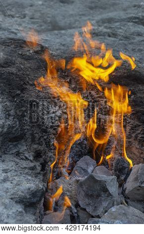 Flames Of Chimera Mount From The Underground. Fire From The Natural Gas In The Rocks In Cirali, Turk
