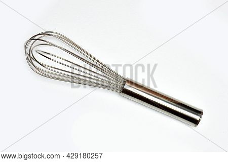 Flat Lay(top View) Of Whisk Isolated On White Background View. Kitchen Equipment. Close Up View. Hob