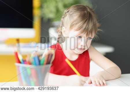 Little Beautiful Girl Draws With Pencils Closeup