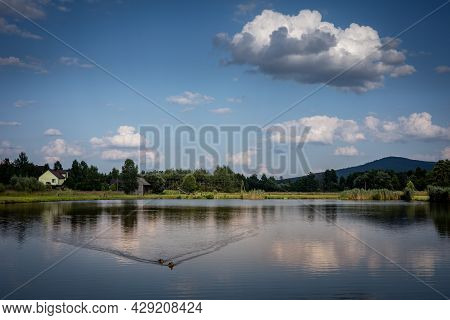 A Calm Lake View With Lysica Mountain In Background. Ciekoty, Swietokrzyskie Mountains, Poland.