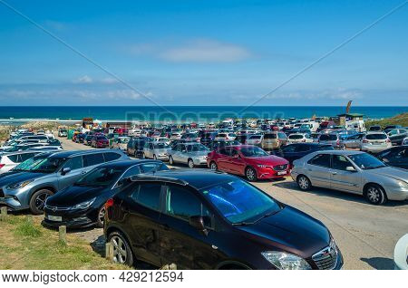 Liencres, Spain - July 10, 2021: Full Beach Parking Lot In Summer, Valdearenas Beach In The Liencres