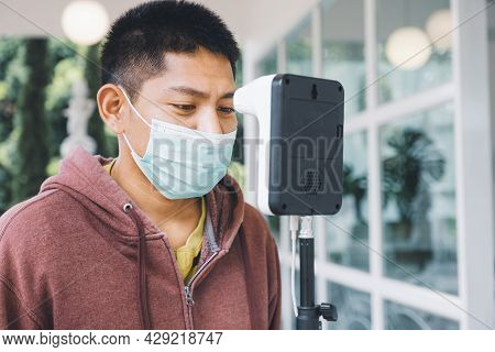The Asian Tourist Man Has Checked Body Temperature With A Thermal Temperature Scanner Detector, New 