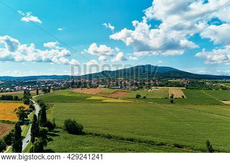 Aerial View Of Beautiful Landscape In Mountains With Forest And Fields. Sleza Mountain Near Wroclaw 