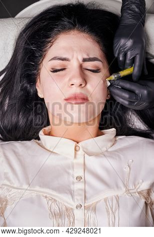 Close-up Vertical Snapshot Of Plasmolifting Procedure Injection. Plasma Injection Into Skin On Cheek