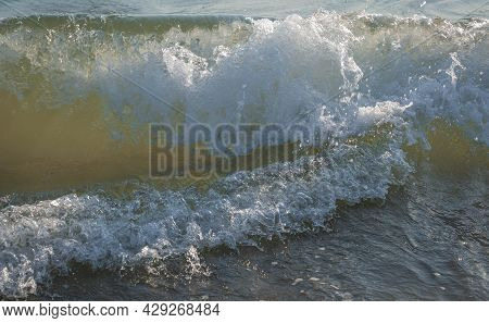 Colored Sea Waves With Splashes And White Breakers In Circeo Park, Sabaudia, Italy