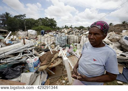 Elderly Collecting Waste For Recycling