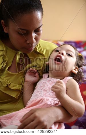 Mother With Daughter With Microcephaly