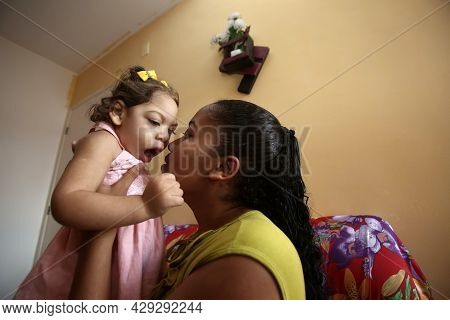 Mother With Daughter With Microcephaly
