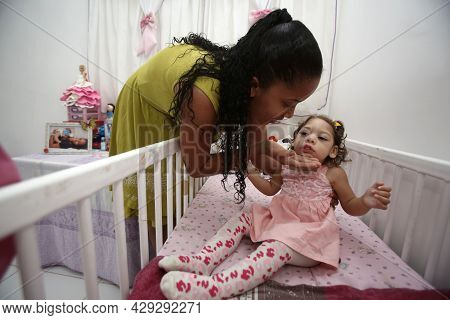 Mother With Daughter With Microcephaly
