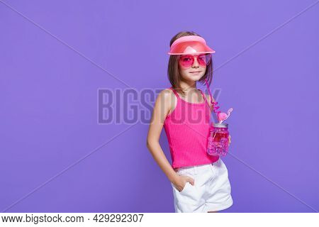 A Little Girl In White Shorts, A Pink T-shirt, Pink Trendy Glasses, With A Drink In Hand And A Summe